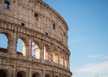 photo of coliseum under blue sky